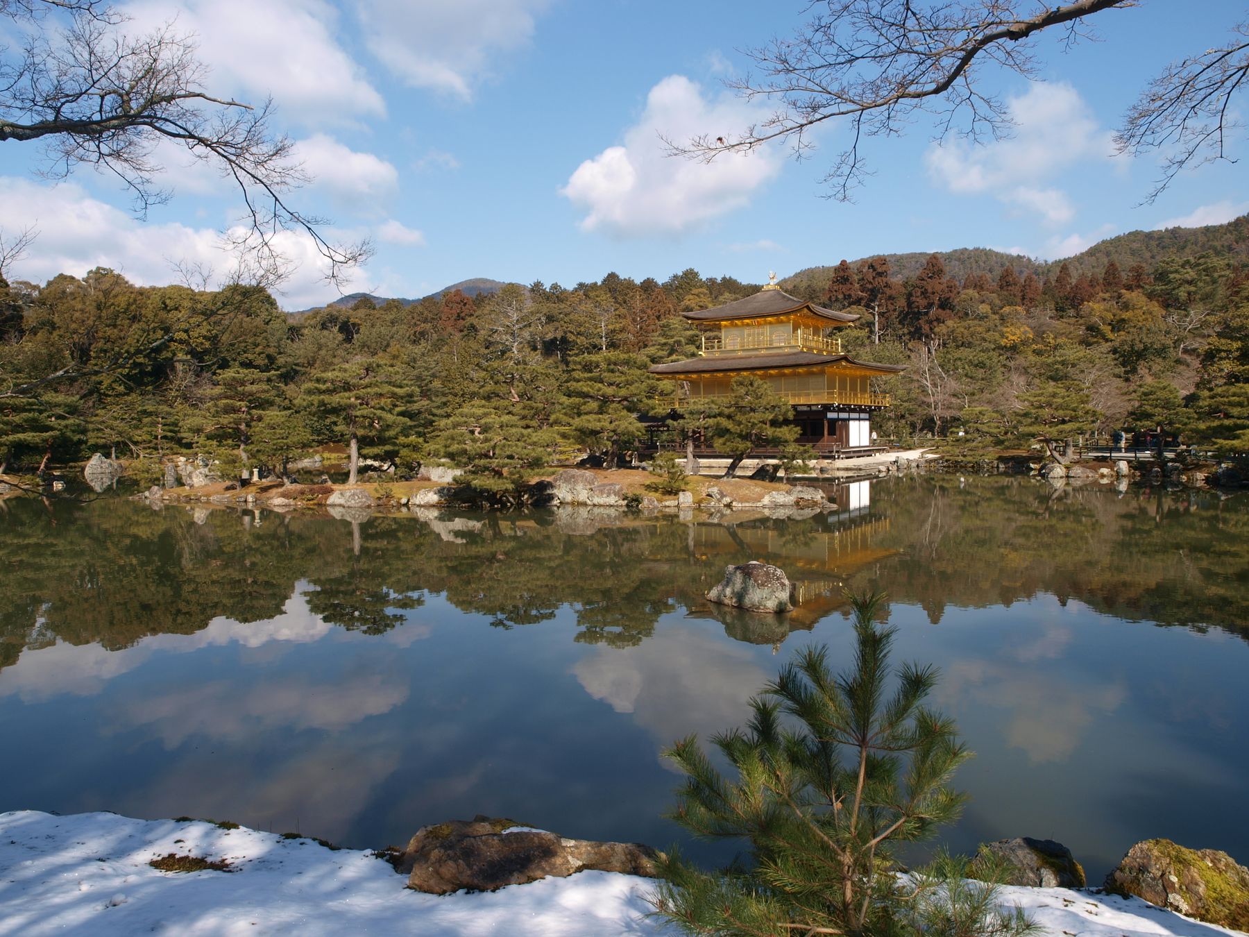 Kinkaku-ji, the Golden Pavilion, reflected in its pond in winter